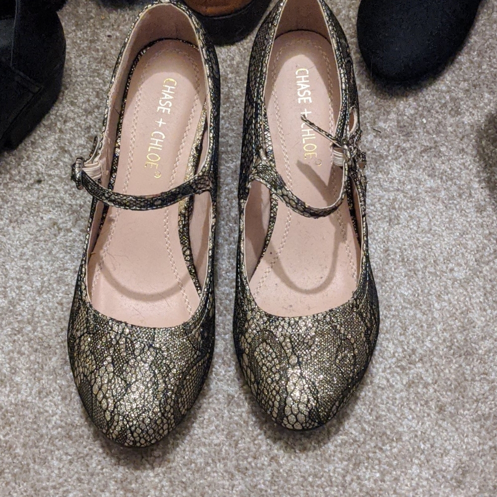 Gold and black heels